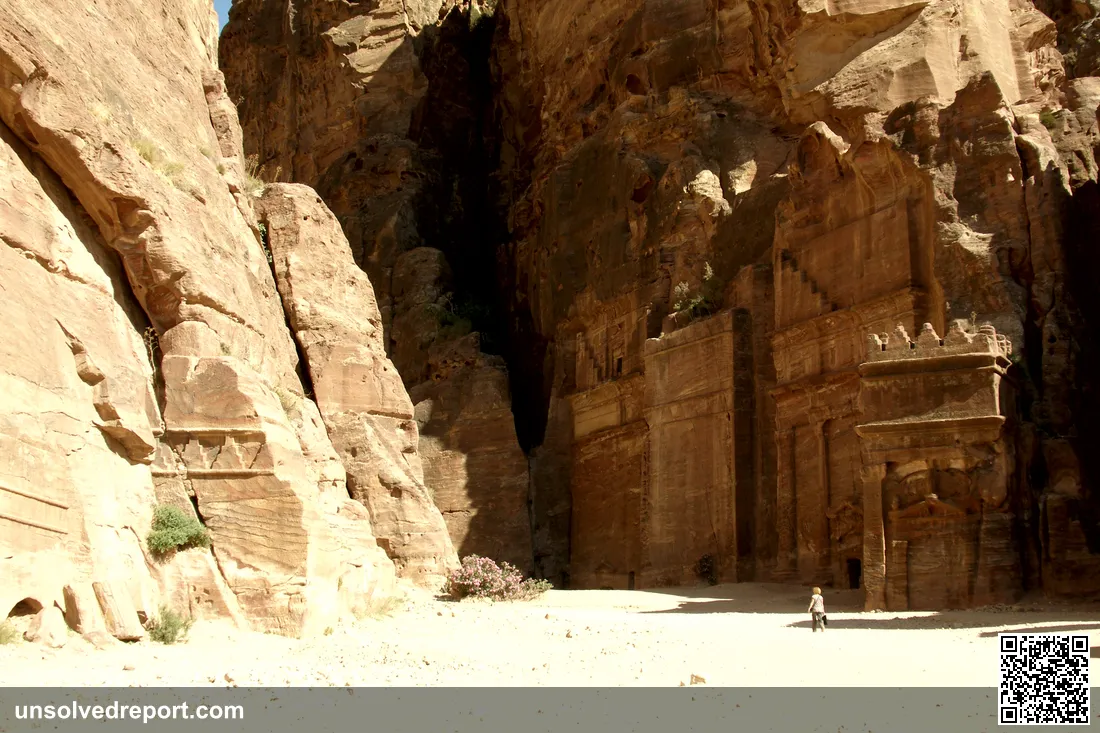 Rock-carved tombs and facades of Petra, the ancient Nabataean capital carved into rose-red sandstone cliffs in Jordan.