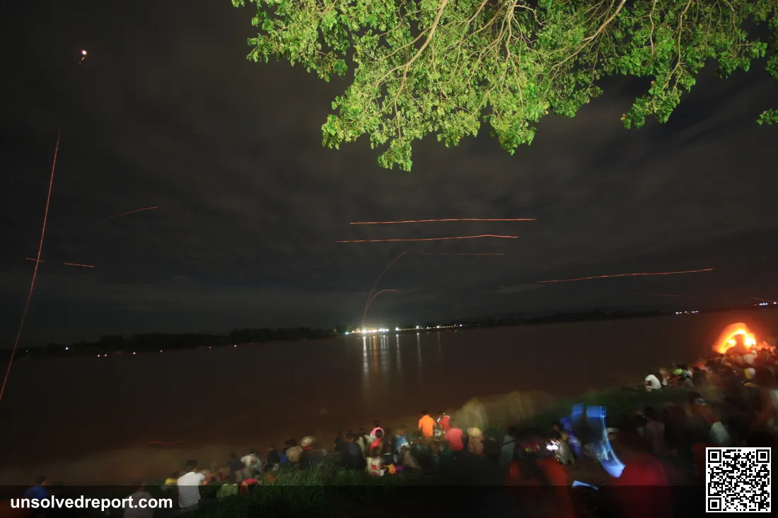 Naga Fireballs (Bung Fai Phaya Nak) rising from the Mekong River at Nong Khai, Thailand, during the end of Buddhist Lent (Wan Ok Phansa)