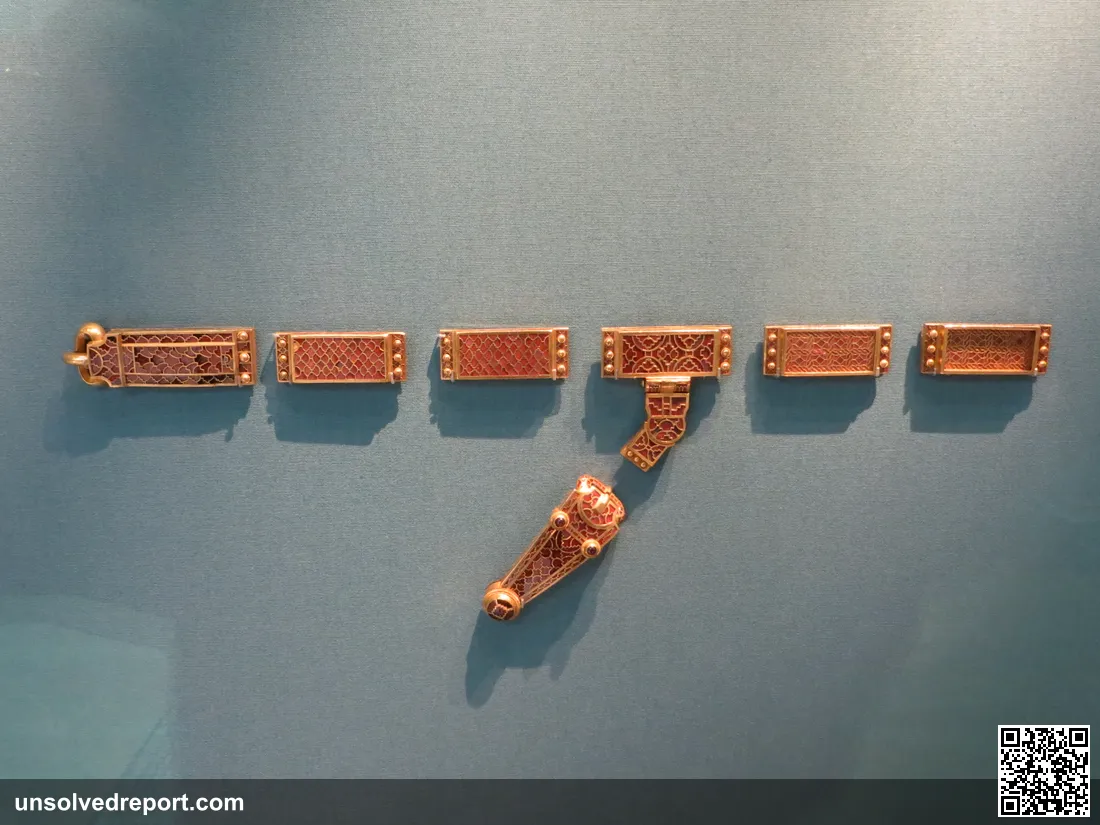 Gold and garnet shoulder clasps and dress fittings from the Sutton Hoo ship burial, c. 625 AD, on display at the British Museum, London