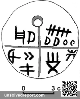 Neolithic clay amulet (retouched). The "v" shaped sign is missing from the upper left quarter. Part of the Tărtăria tab…